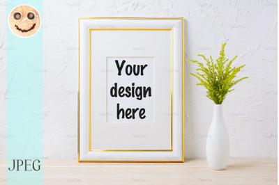 Gold decorated frame mockup with ornamental grass in exquisite vase
