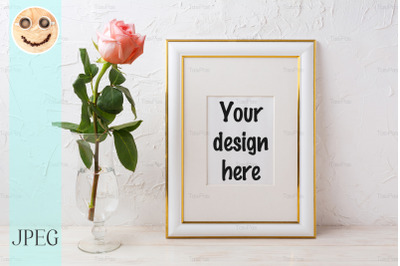 Gold decorated frame mockup with rose in exquisite glass vase