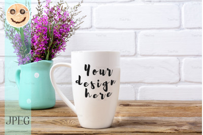 White coffee cappuccino mug mockup with magenta flowers in mint pitche