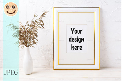 Gold decorated frame mockup with dried grass