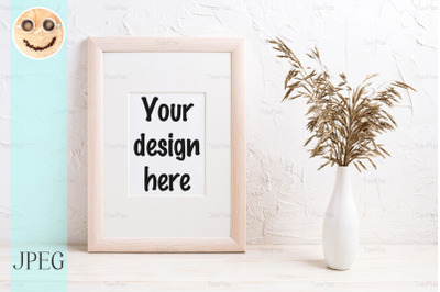 Wooden frame mockup with dried grass