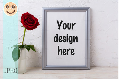 Silver frame mockup with red rose in glass vase