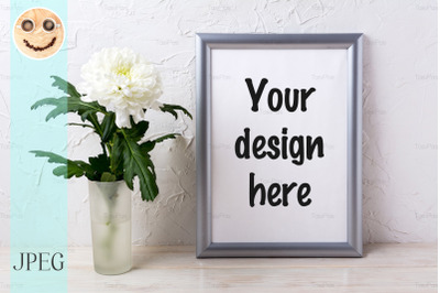 Silver frame mockup with white chrysanthemum in glass vase