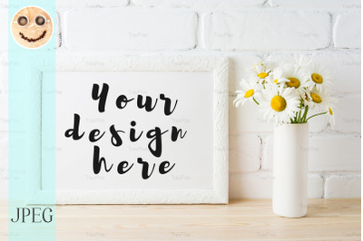 White landscape frame mockup with daisy flower in styled vase