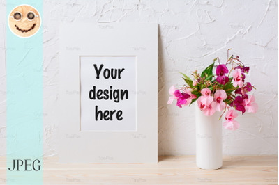 White mat frame mockup with pink and purple flower bouquet
