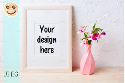 Wooden frame mockup with purple wildflowers in pink vase