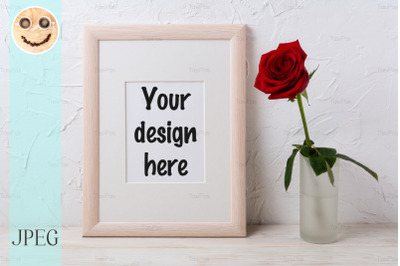 Wooden frame mockup with red rose in glass vase