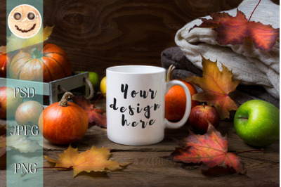 White coffee mug mockup with fall leaves&2C; pumpkins