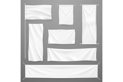 White textile advertising banners. Blank fabric cloths hanging on rope