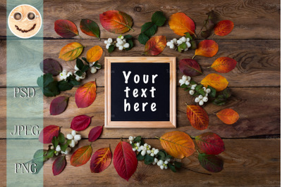 Wooden square picture frame mockup with fall leaves