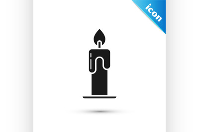 Black Burning candle icon isolated on white background. Cylindrical ar