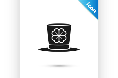 Black Leprechaun hat and four leaf clover icon isolated on white backg