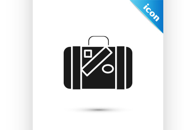 Black Suitcase for travel and stickers icon isolated on white backgrou