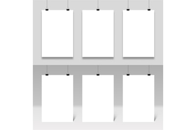 Poster mockup hanging on paperclips. Realistic posters frames template