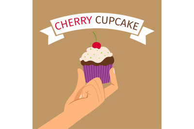 Hand holding cupcake with cherry