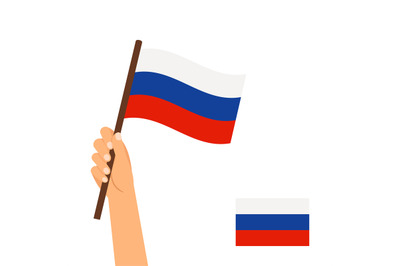 Human hand holding flag of Russia