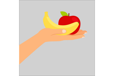 Hand holding banana and apple