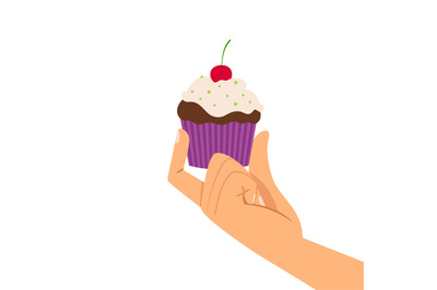 Hand holding cherry cupcake