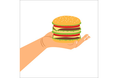 Hand holding hamburger