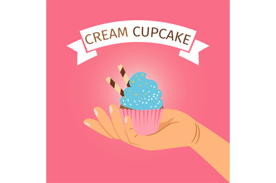 Hand holding blue cream cupcake