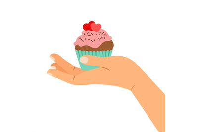 Hand holding cupcake with two hearts