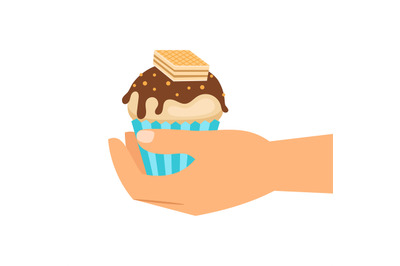 Hand holding wafer cupcake