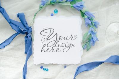 Square wedding mock up with blue silk ribbons and flowers