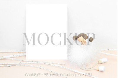 Mockup card with statuette girl