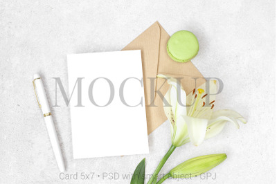 Flat lay invitation card with craft envelope