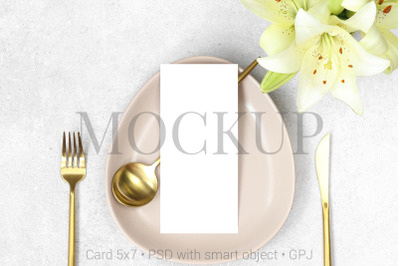 Mockup wedding menu with gold cutlery and lilies