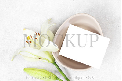 Mockup wedding number card with flowers on grey background