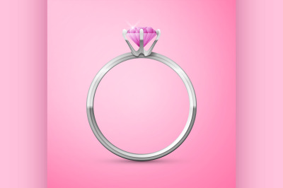 silver wedding ring on pink background