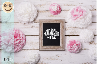 Wooden frame mockup with paper flowers.