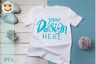 Womens T-shirt mockup with turquoise loafers.