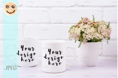 Two coffee mug mockup with pink beige wild flowers.