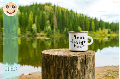 White campfire mug mockup with river bank view.