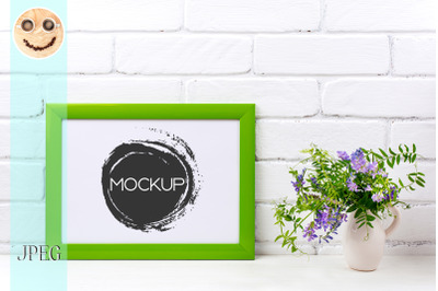 Green landscape frame mockup with purple bird vetch