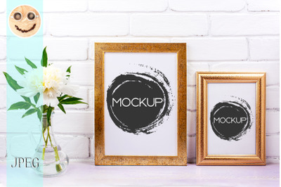 Two golden poster frames mockup with white peony