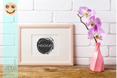 Wooden landscape frame mockup with pink orchid