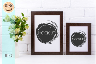 Two black brown poster frames mockup with spirea branch