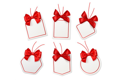 Tags with red bows. Blank white price labels with silk scarlet ribbons