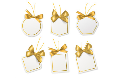 Tags with gold bows. Blank white price paper labels with golden ribbon