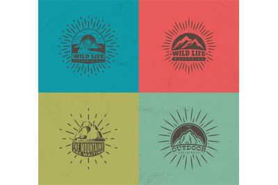 Mountain emblems. Set of four vector colored vintage badges&2C; mountaine