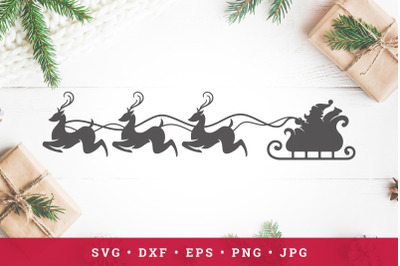 Santa Claus rides reindeer sleigh. Vector silhouette. Cut file clipart