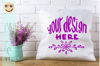 Pillow mockup with magenta wildflowers.