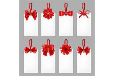 Gift cards with ribbons. Tags with textile bow from elegant silk ribbo