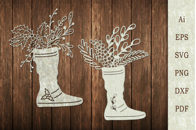 Papercut template made of flowers and branches in a boot.