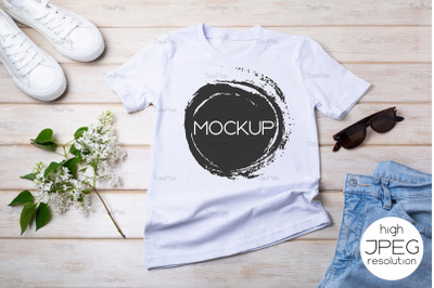 Womens T-shirt mockup with lilac and white sneakers.