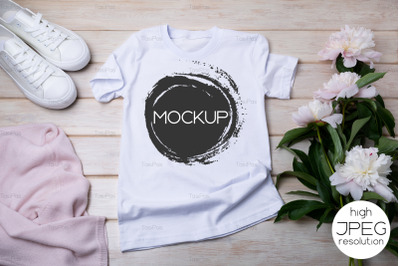 Womens T-shirt mockup with white sneakers and peonies.