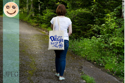 Walking woman holding tote bag mockup.